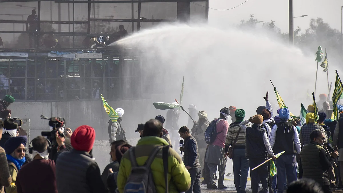 Security personnel use water cannons to disperse farmers in Patiala on 14 December (photo: PTI)