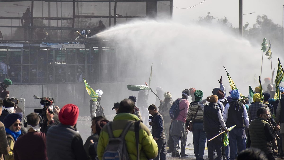 Security personnel use water cannons to disperse farmers in Patiala on 14 December (photo: PTI)