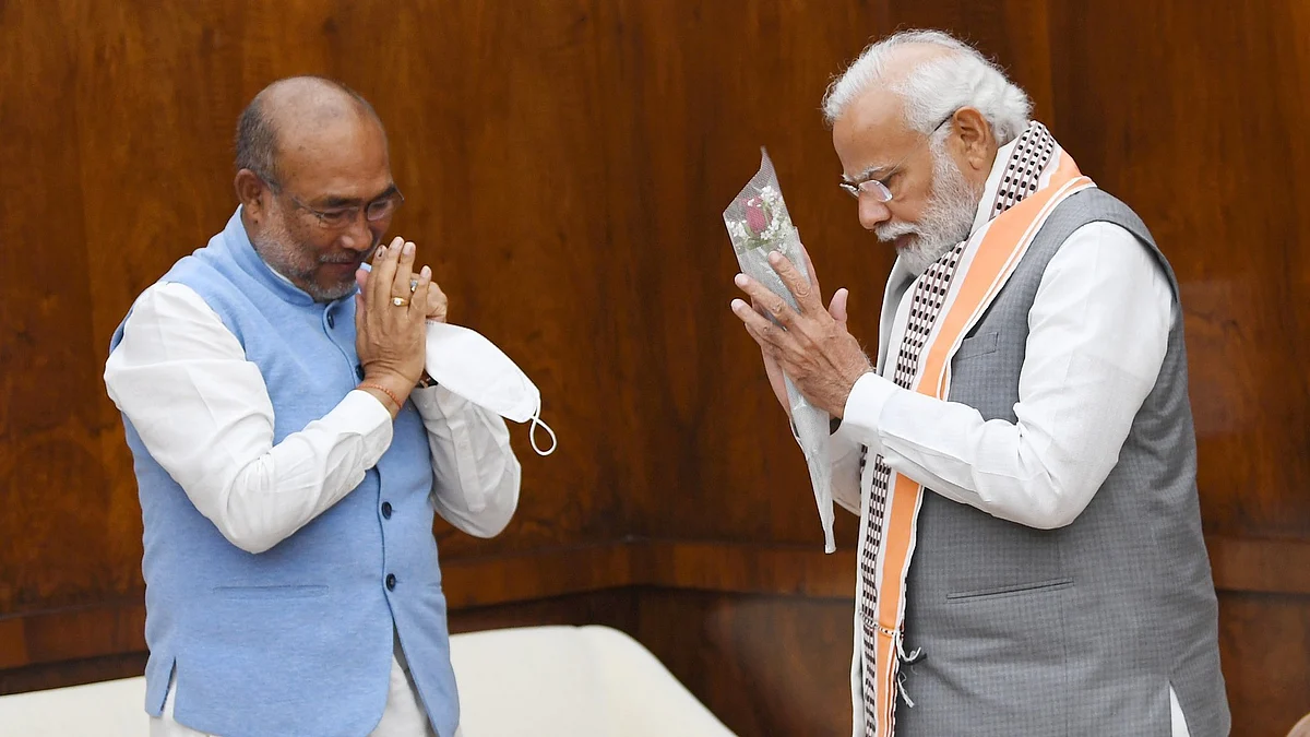 Chief minister N. Biren Singh (left) and prime minister Narendra Modi (right) salute each other