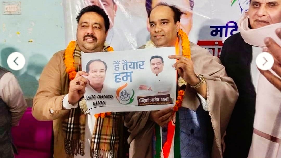 Asim Ahmed Khan (right)