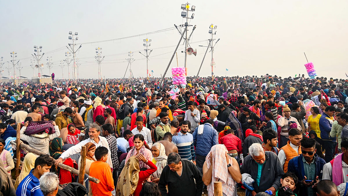 File photo of devotees gathering for a holy dip at Maha Kumbh