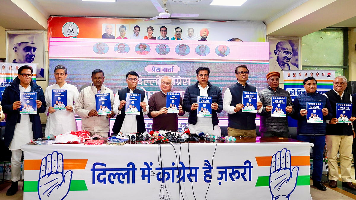 Jairam Ramesh (centre) with Devender Sharma (R) and Pawan Khera at the manifesto launch (photo: Vipin/NH)
