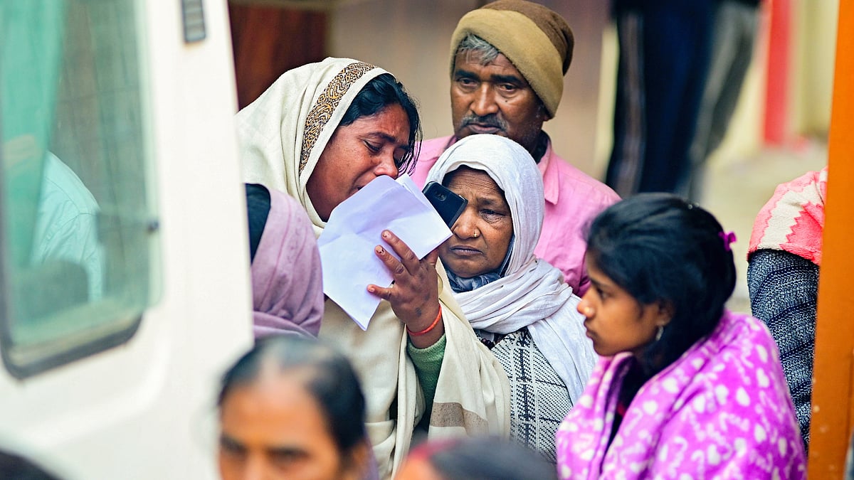 Anxious relatives wait for news of missing loved ones (photo: PTI)