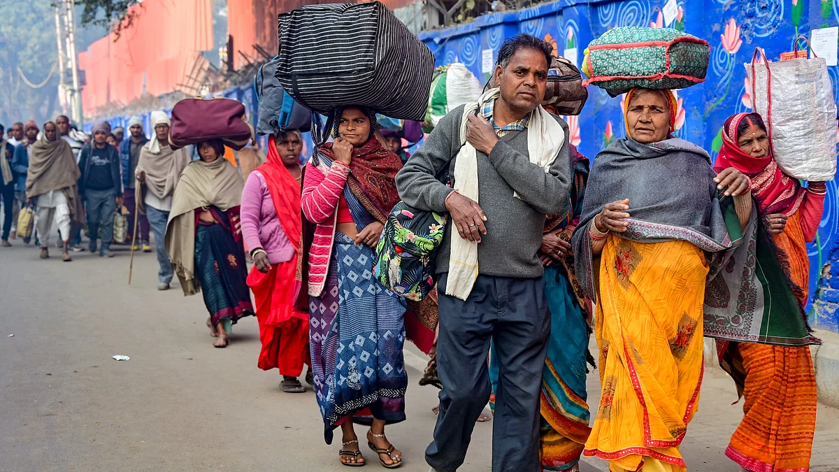 Returning devotees at Prayagraj station (photo: PTI)