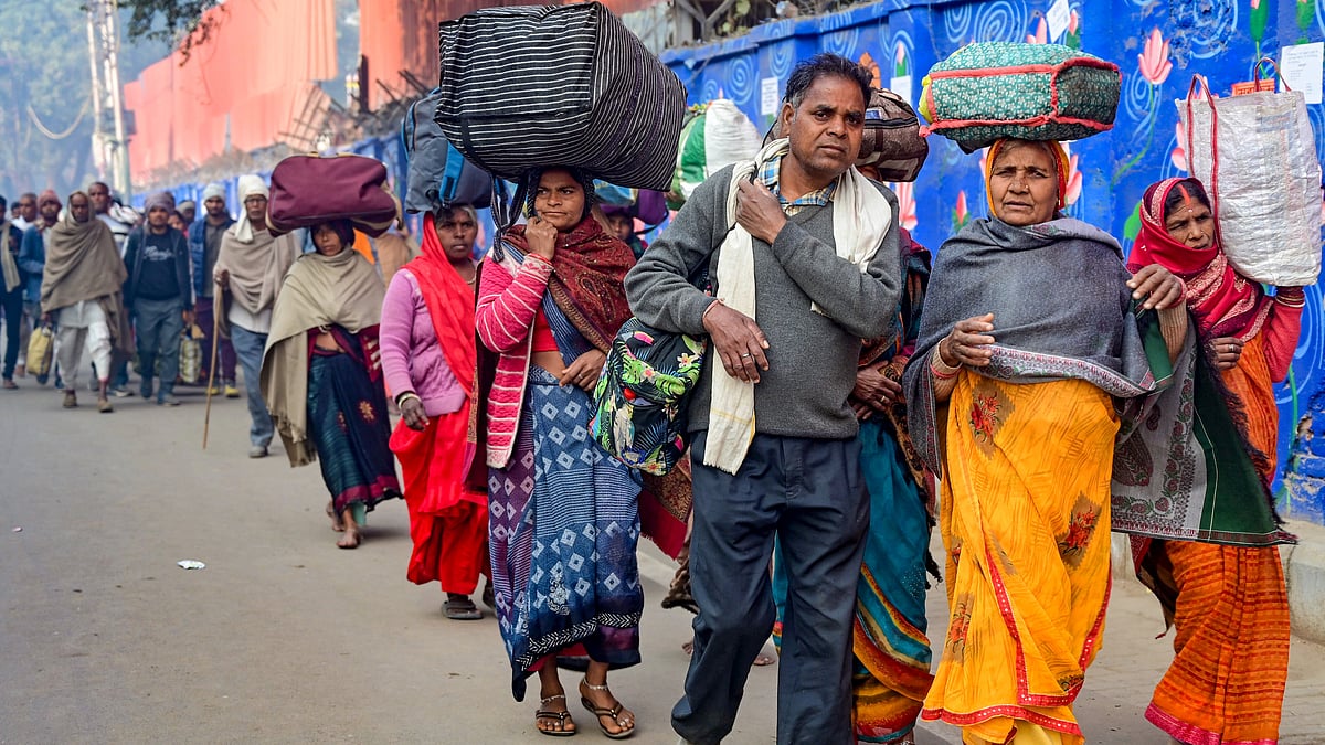 Returning devotees at Prayagraj station (photo: PTI)