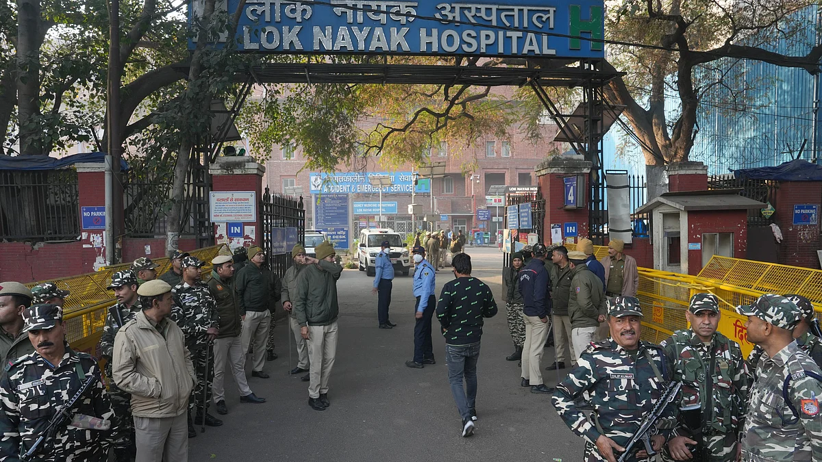 Security personnel stand guard outside Lok Nayak Hospital on 16 February (photo: PTI)