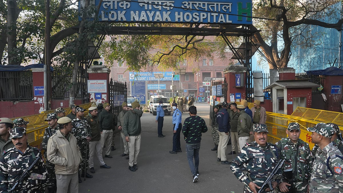 Security personnel stand guard outside Lok Nayak Hospital on 16 February (photo: PTI)