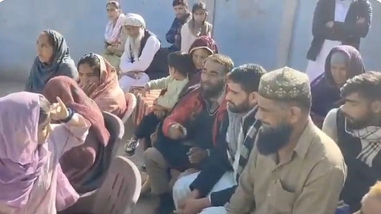 The bereaved family of Makhan Din (25) who killed himself allegedly after police torture 