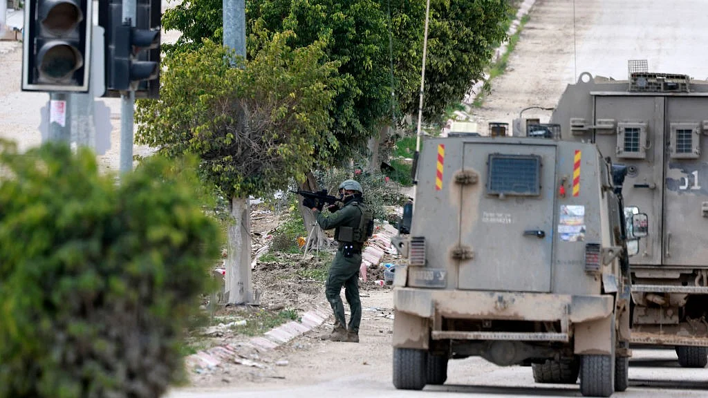 Israeli forces outside a refugee camp in Tulkarem in the occupied West Bank, 21 Feb 2025 (Getty Images)