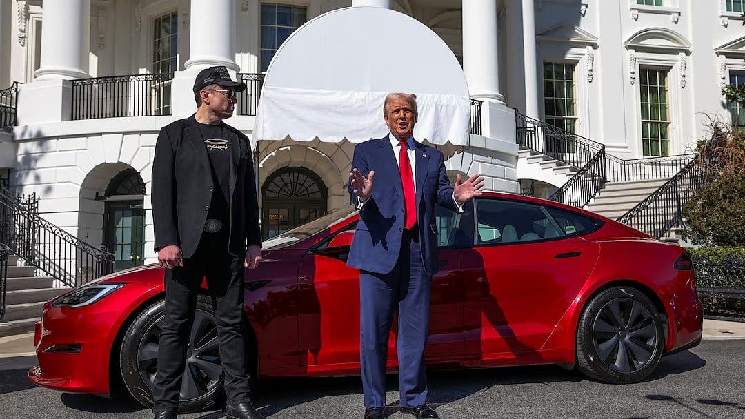 Donald Trump and Elon Musk with Tesla parked at White House (photo: @MeidasTouch/X)