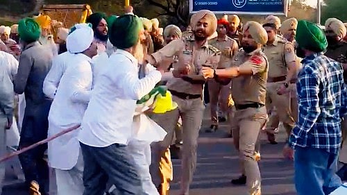 Farmers being detained by the police during a protest in Mohali