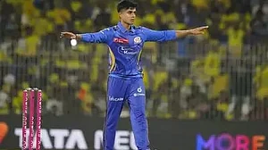Vignesh Puthur celebrates one of his wickets on 23 March (photo: BCCI)