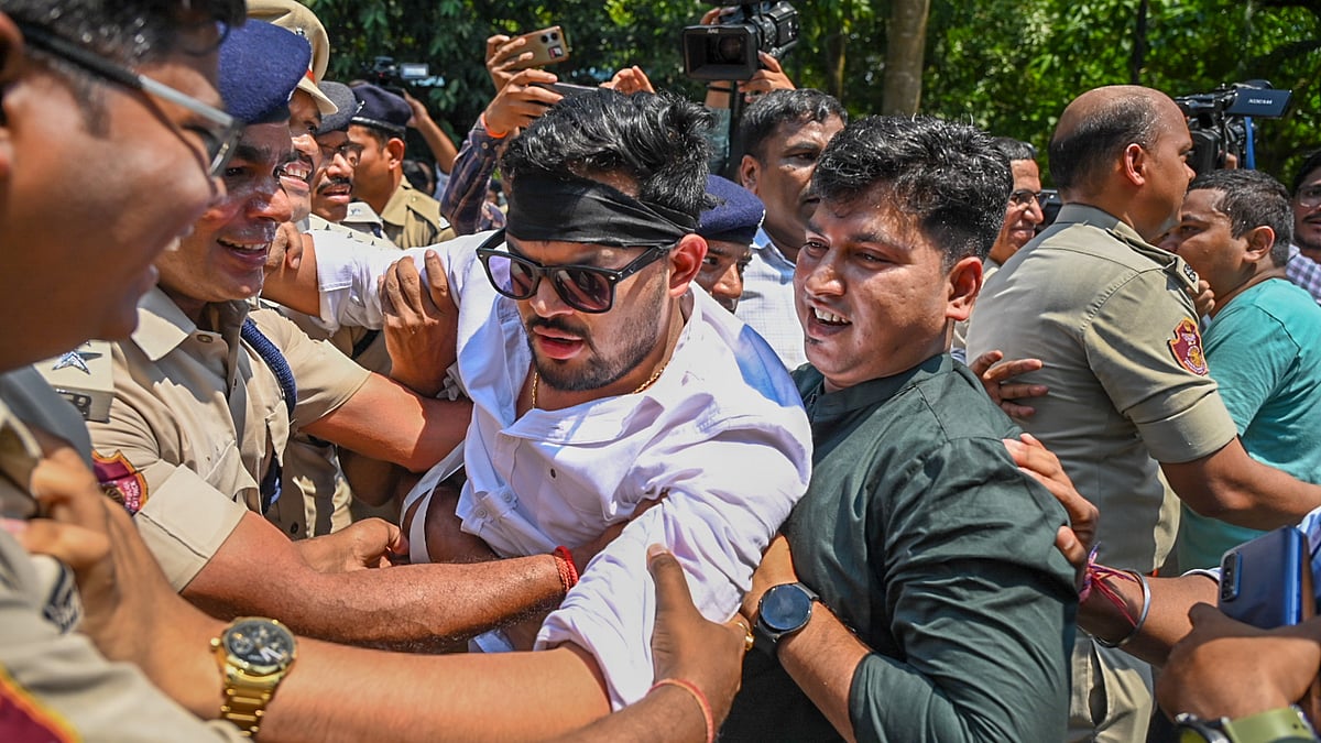 Police remove Congress MLAs who were staging a protest in front of East Gate of Assembly