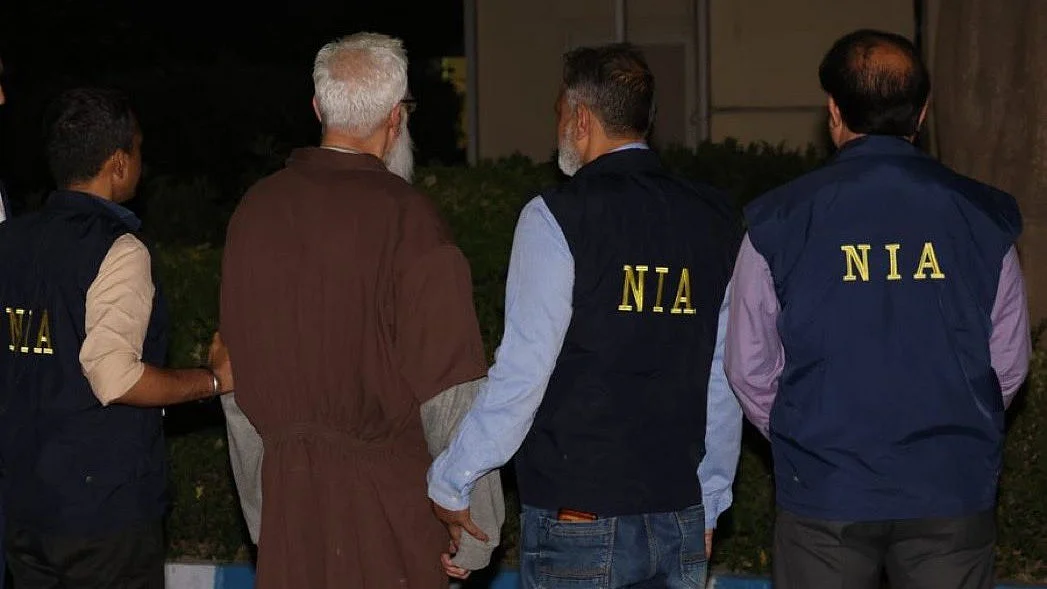 Tahawwur Rana with NIA agents who formally arrested him on arrival at Delhi Airport from the US