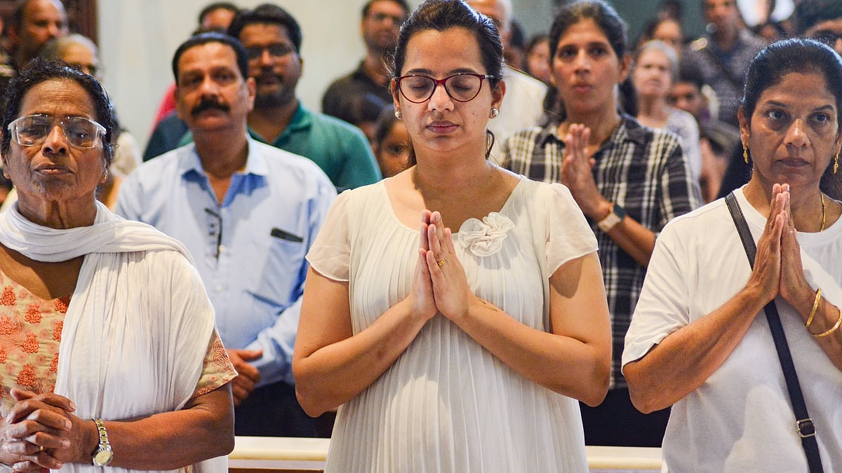 People offer prayers at St. John the Baptist Church in Thane (photo: PTI)