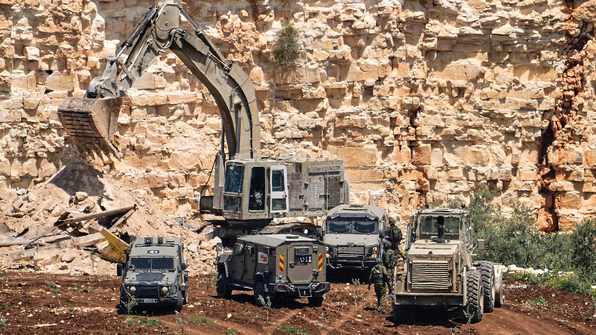 Israeli forces surround a quarry near the West Bank village of Qabatiya (photo: AP/PTI)
