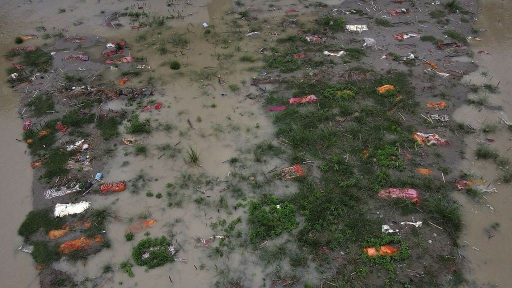 The Ganga washes out shallow graves of suspected Covid-19 vcitims near an Allahabad cremation spot