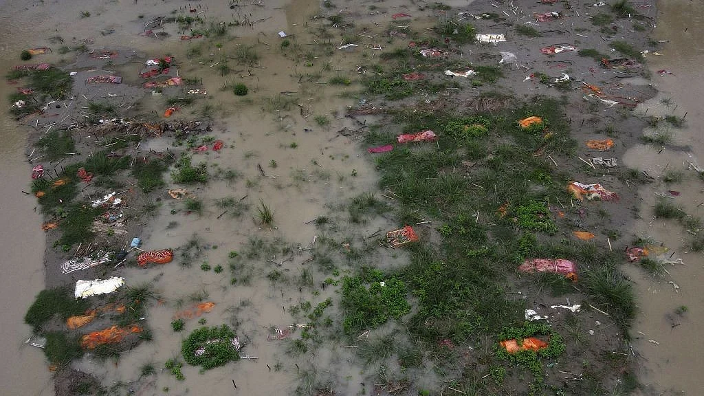 The Ganga washes out shallow graves of suspected Covid-19 vcitims near an Allahabad cremation spot