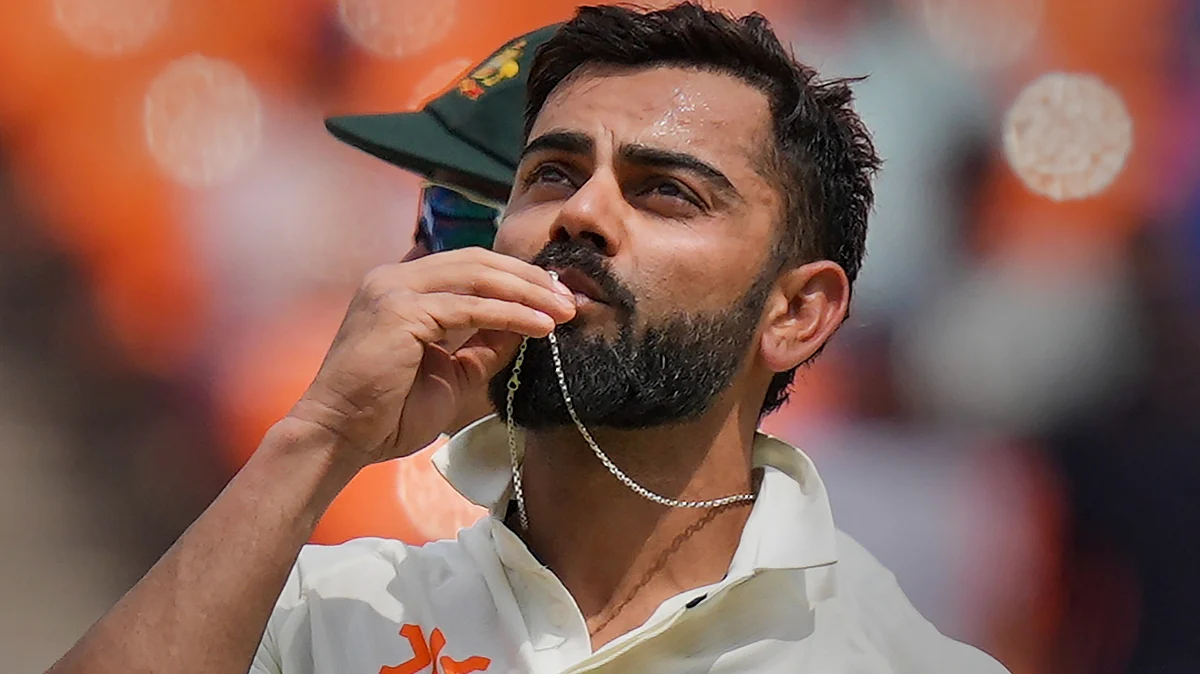 In this file image from 2023, Kohli celebrates after a century against Australia in Ahmedabad