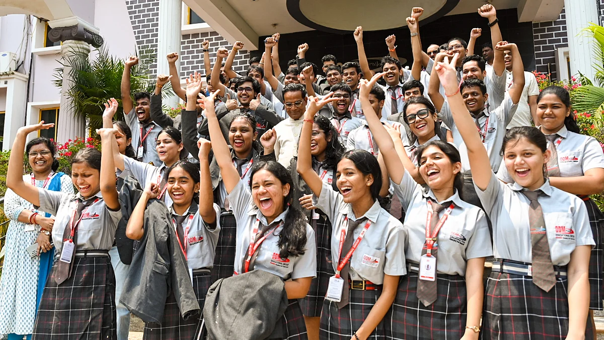 Students celebrate after CBSE declars board exam results on 13 May (photo: PTI)
