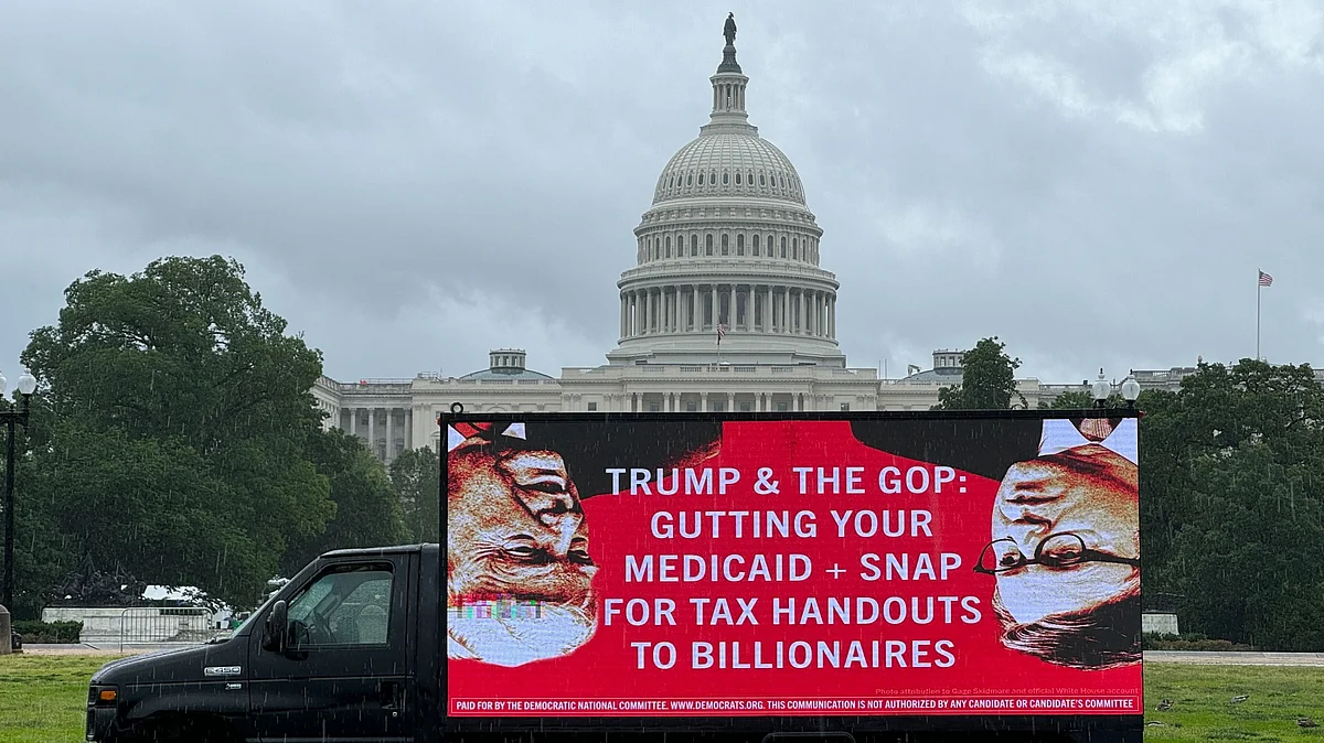 A mobile billboard in front of Capitol Hill talks of gutted Medicaid and tax handouts for billionaires
