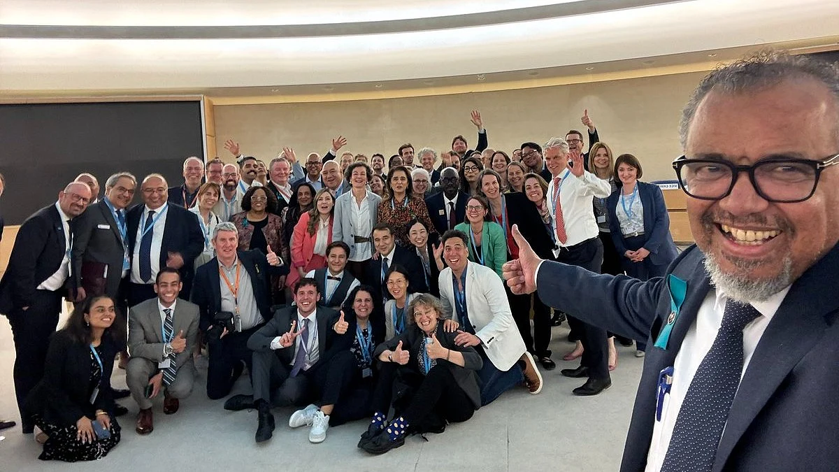 Dr Tedros Ghebreyesus celebrates with a multinational team the WHO resolution on the Pandemic Accord