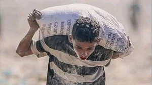 What price aid? A child struggles with a sack of precious flour in Gaza (representative image)
