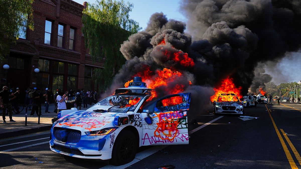 A vehicle burns in downtown Los Angeles (photo: AP/PTI)