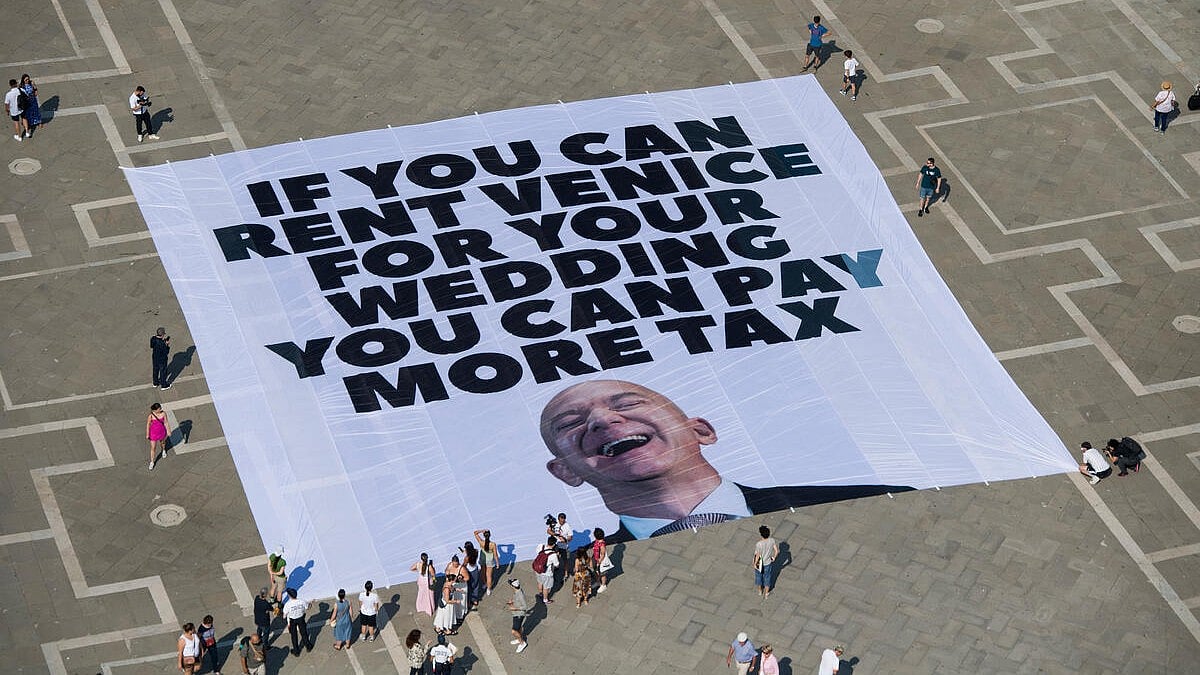 ‘Kisses yes, Bezos no’: protest in Venice over wedding bonanza