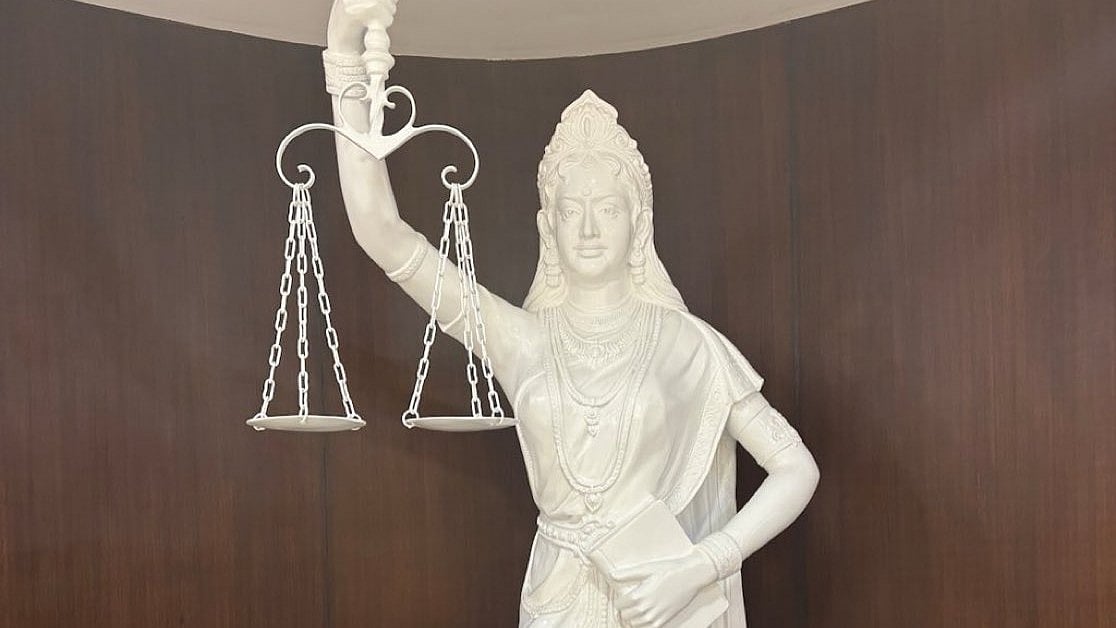 Image of the new icon of Lady Justice, in sari-blouse and Indian style of jewellery, eyes unbound