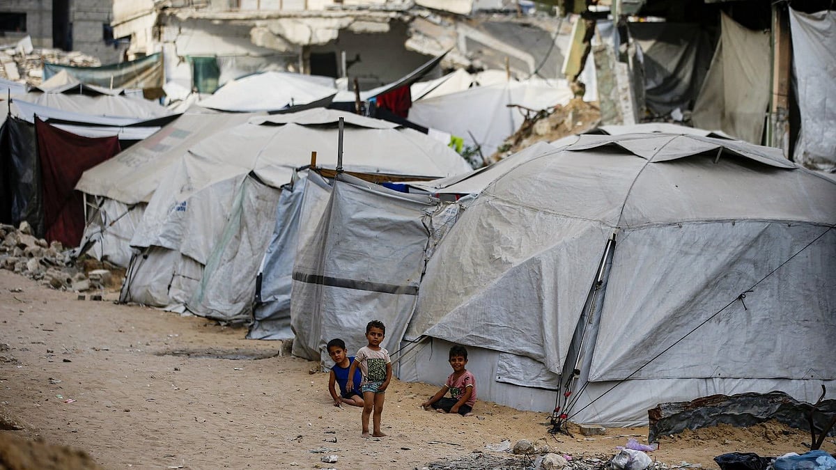 Children at a camp in Gaza (photo: @AbujomaaGaza/X)