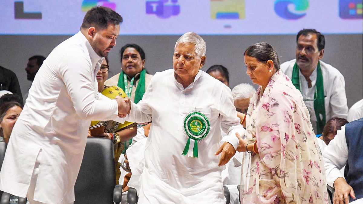 File photo of RJD founder Lalu Yadav with son Tejashwi and Rabri Devi