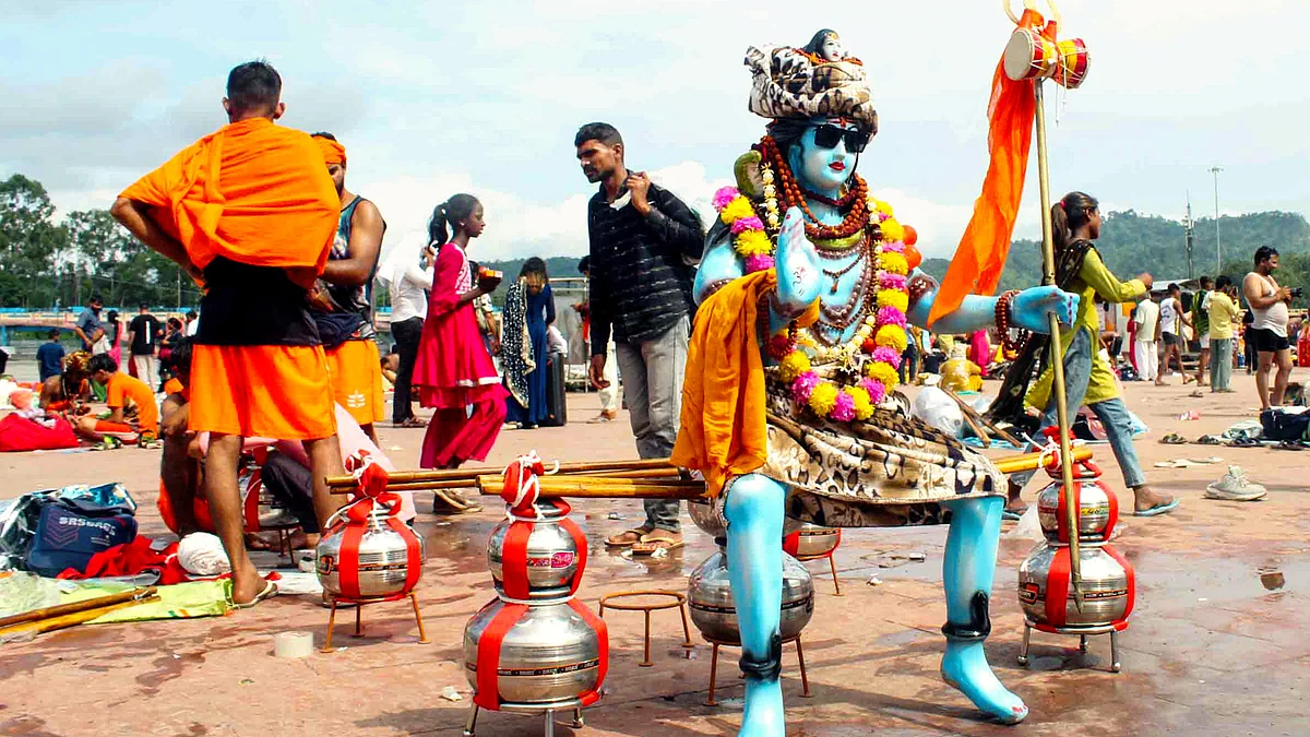 A 'kanwariya' dressed as Lord Shiva waits to collect water from the Ganga in Haridwar (photo: PTI)