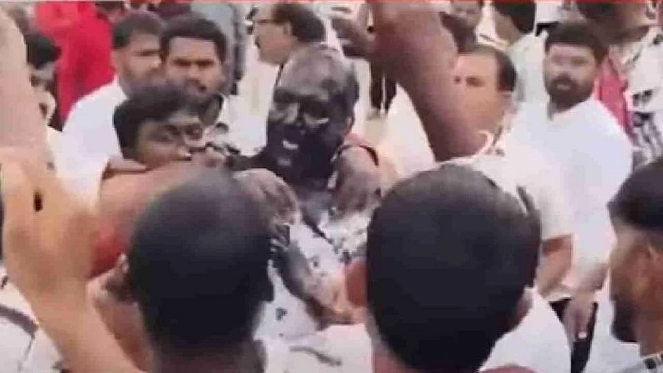 A mob dragged the Sambhaji Brigade leader out of his car and smeared his face with ink