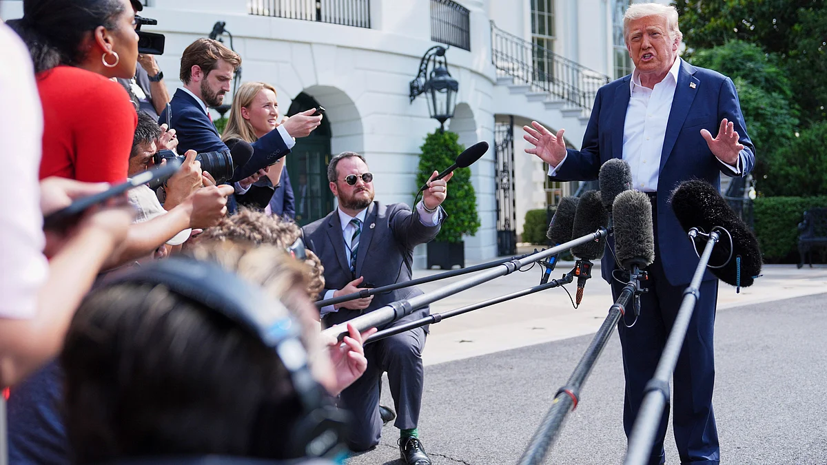 Donald Trump speaks with reporters at White House on 11 July (photo: AP/PTI)