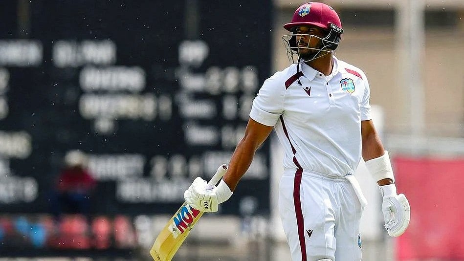 A crestfallen Roston Chase walks back to the dressing room
