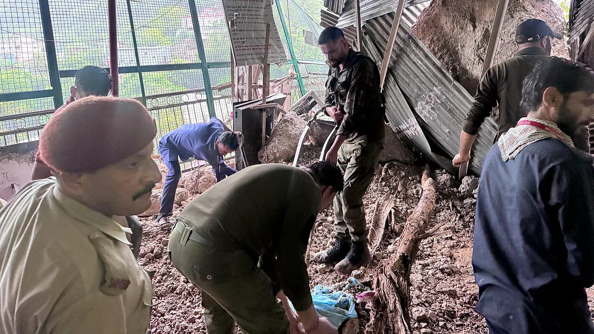 Police probe the scene in Reasi district on 21 July (photo: PTI)