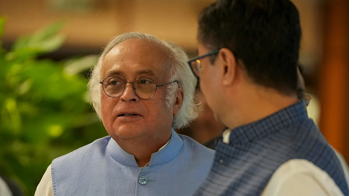 Kiren Rijiju and Jairam Ramesh at Parliament in New Delhi (photo: PTI)