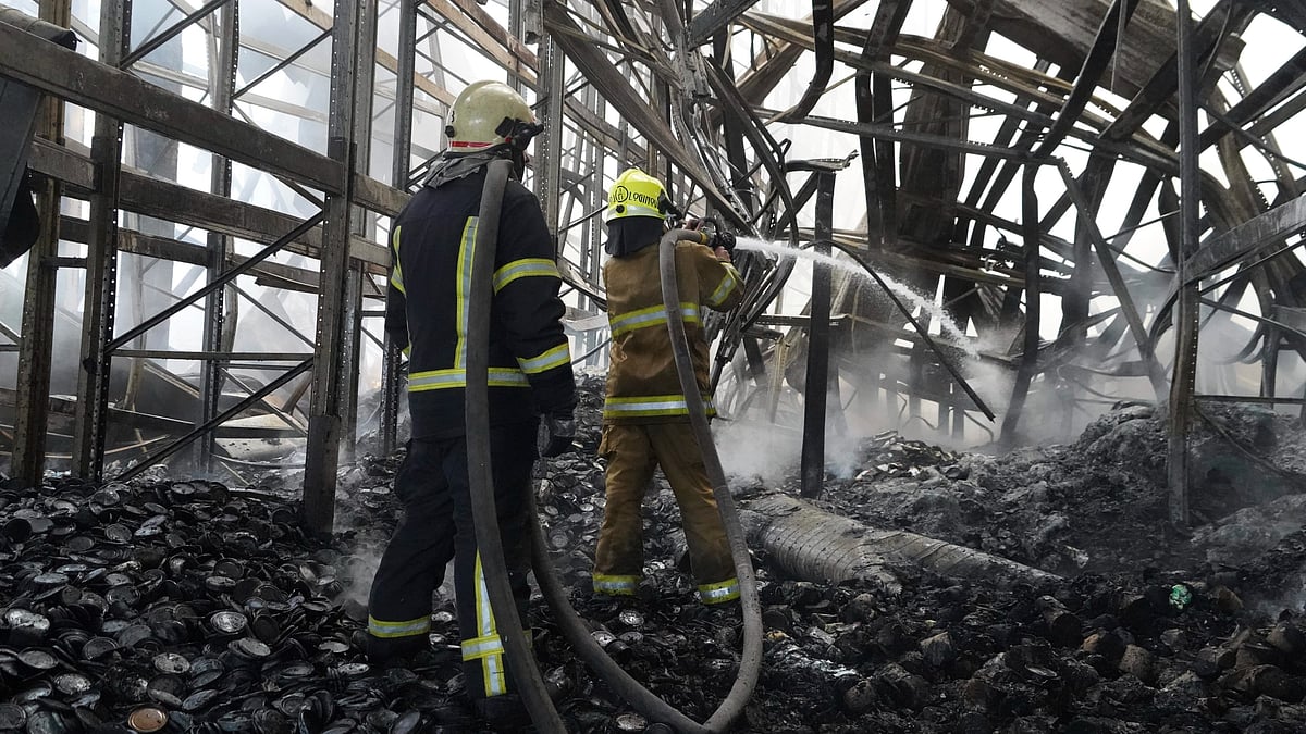 Firefighters tackle the blaze after a Russian attack in Kharkiv on 30 July (photo: AP/PTI)