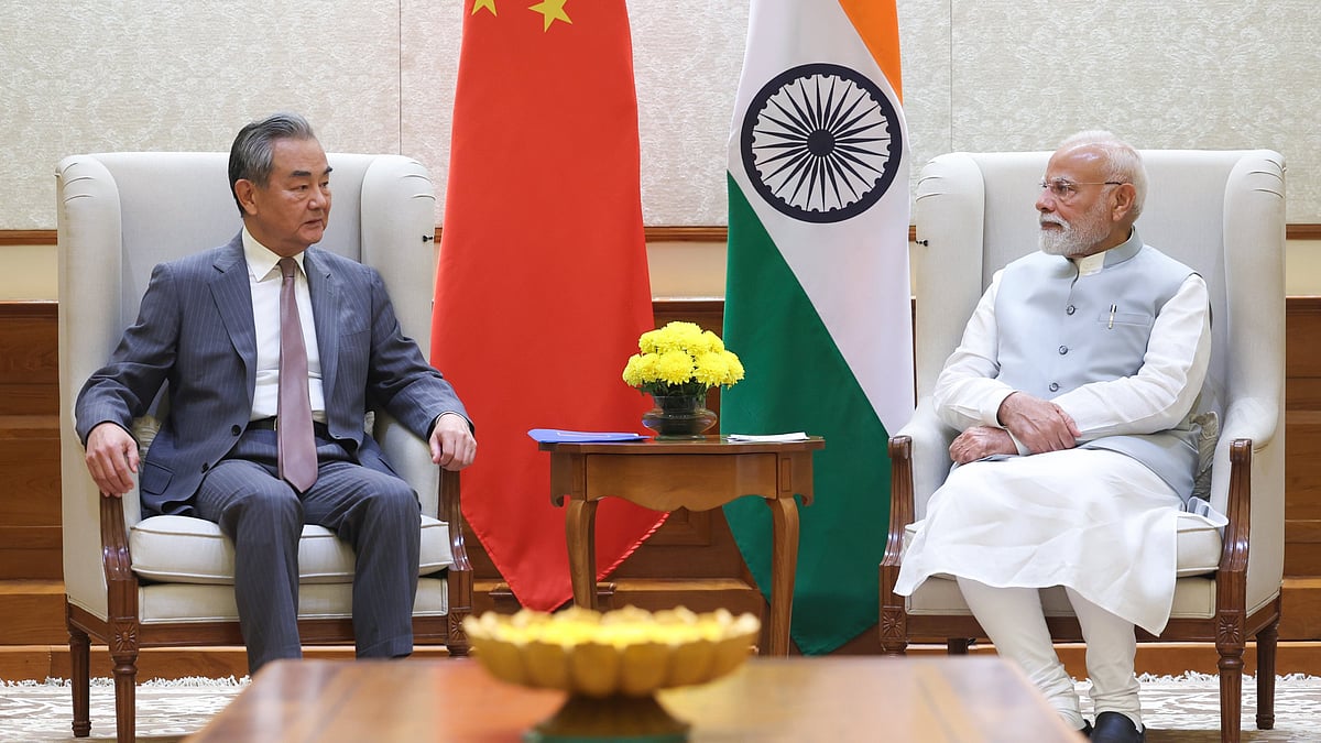 China's foreign minister Wang Yi in PM Narendra Modi's office. Neither looks affable, both stern