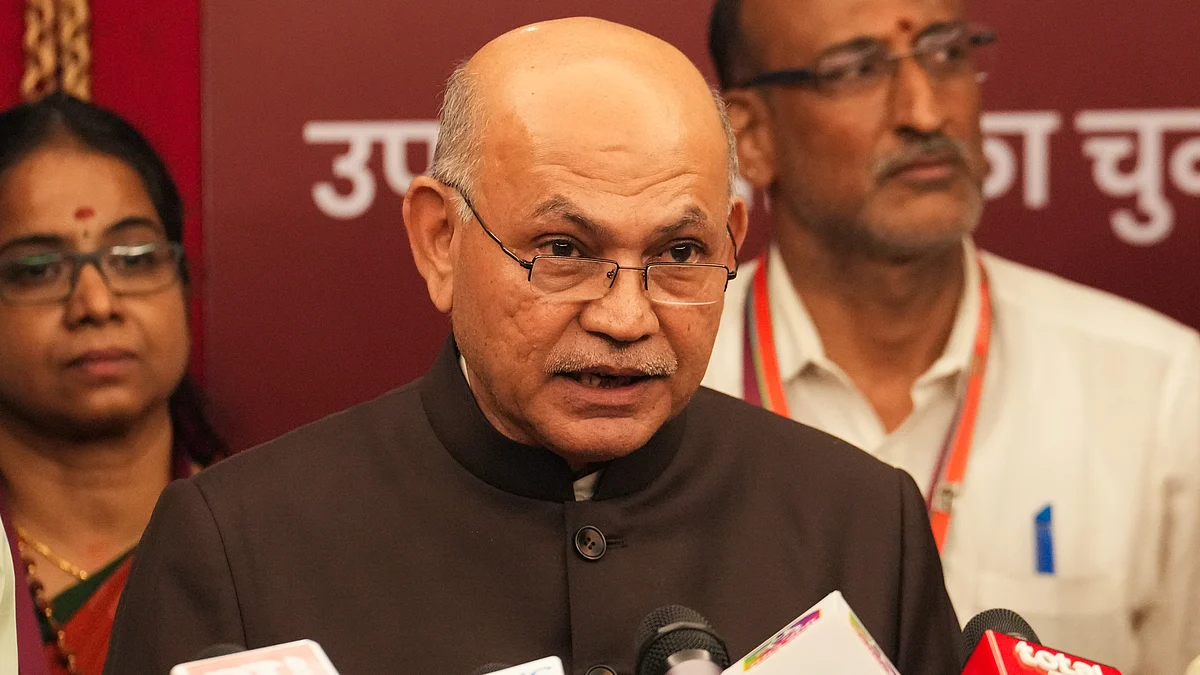 Returning officer and Rajya Sabha secretary-general Pramod Mody announces the election results