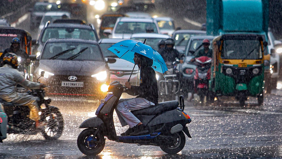 Commuters navigate Bengaluru roads amid heavy rain