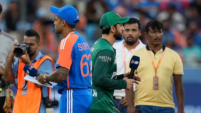 Cold vibes: Suryakumar Yadav (left) and Salman Ali Agha walk away after the toss