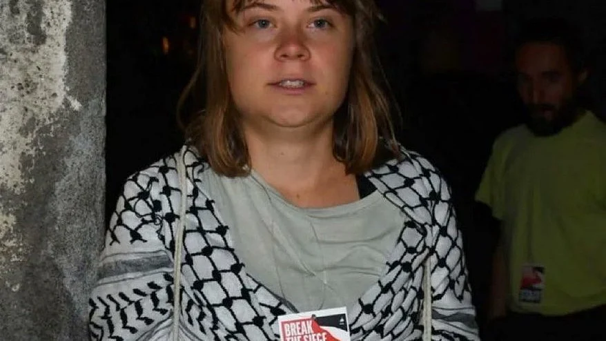 Greta Thunberg with her keffiyeh and 'Break the Seige' badge as a member of the Global Sumud Flotilla