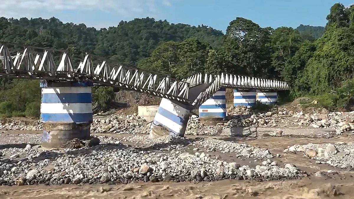 Dudhia iron bridge lies damaged after landslides and heavy rainfall in Darjeeling.