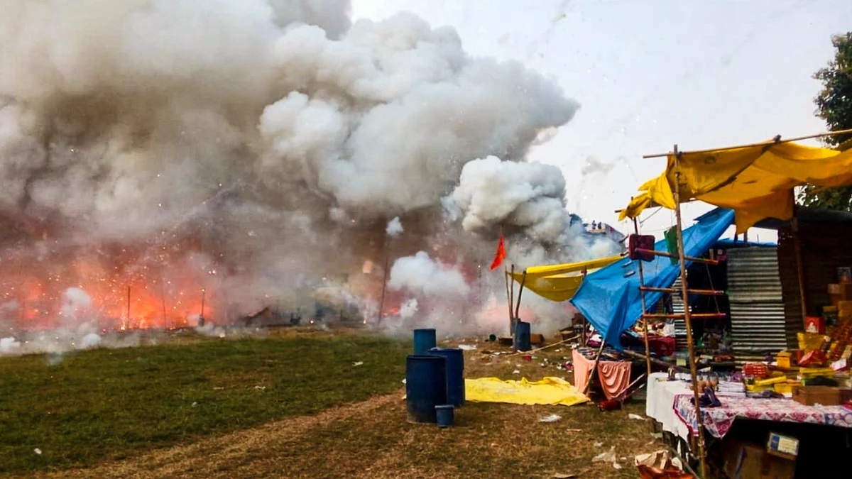 Dark smoke billows out after a fire broke out at a firecrackers market, in Fatehpur, UP (PTI)