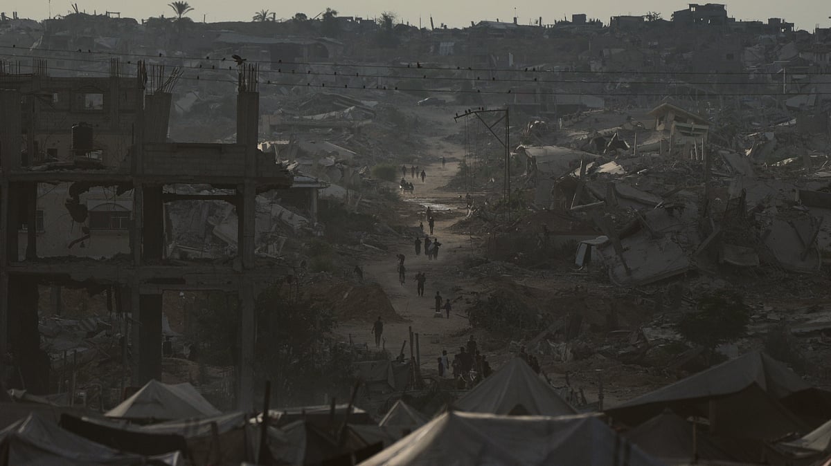 Displaced Palestinians navigate the rubble of destroyed homes in Khan Younis.
