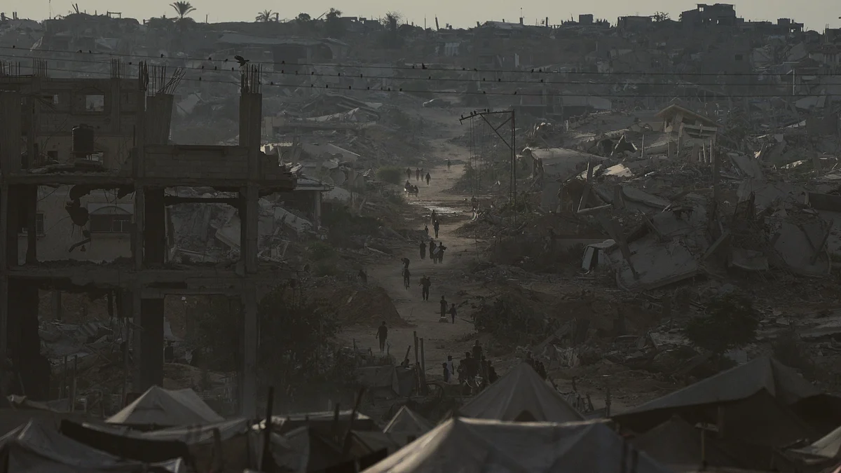 Displaced Palestinians navigate the rubble of destroyed homes in Khan Younis.