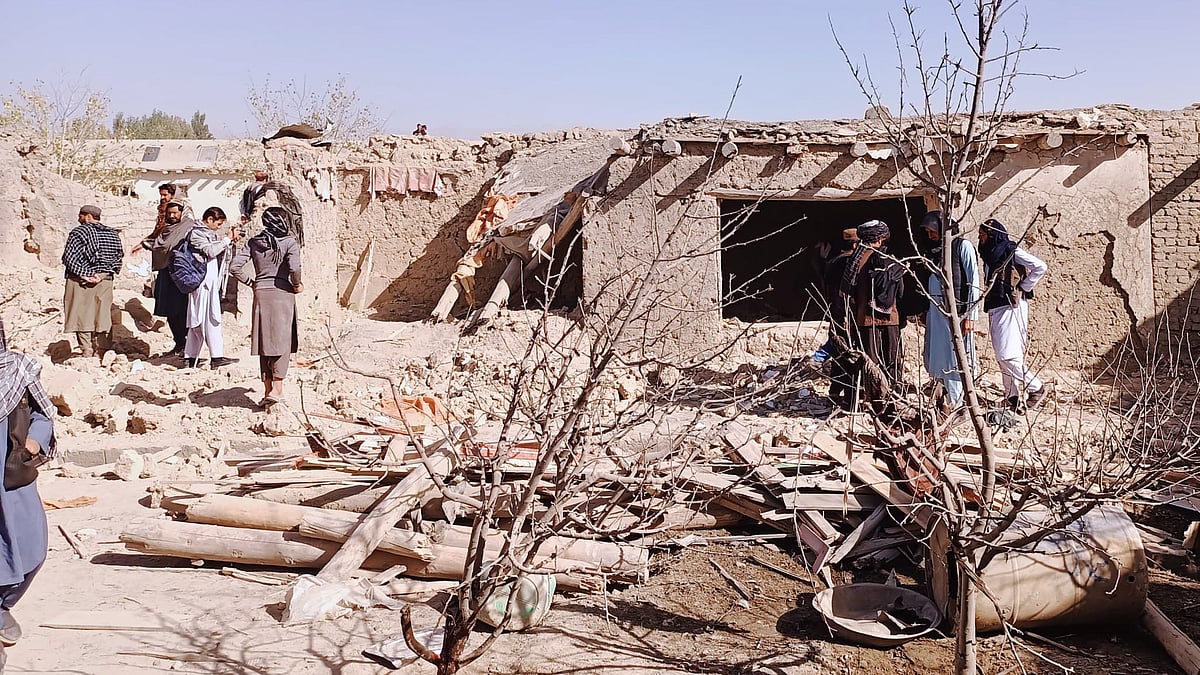 Locals inspect aftermath of Pakistani cross-border strike in Paktika on 18 October.