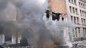 Smoke billows from a kindergarten in Kharkiv after a Russian drone strike on 22 October.